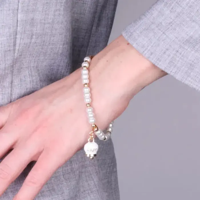 Bracciale in Metallo con sfere e campanella Capri bianca
