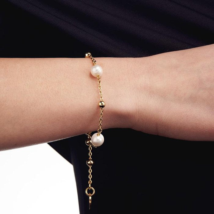 Bracciale in bronzo dorato e perle naturali