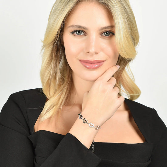 BRACCIALE DONNA IN ACCIAIO CON CUORI TRAFORATI E CRISTALLI BIANCHI